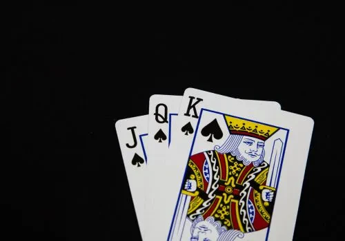 Some playing cards about to be played in spades